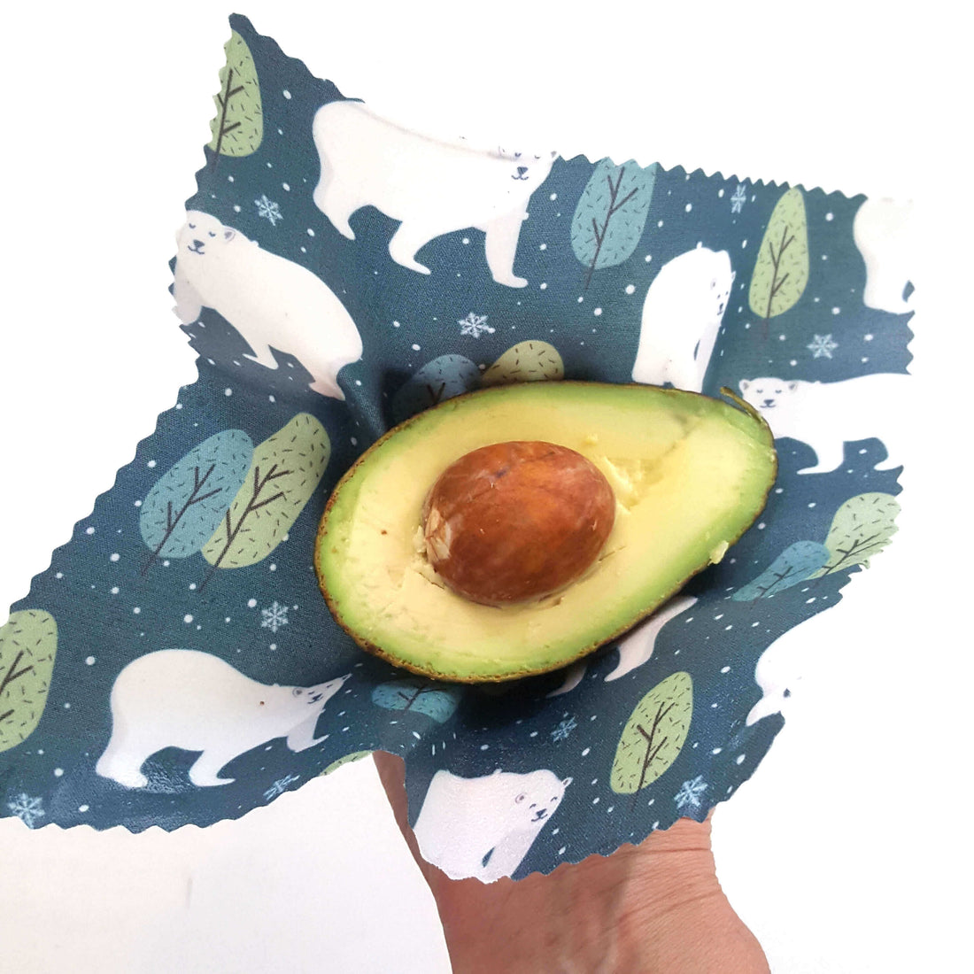 Polar bears print beeswax wraps covering avocado