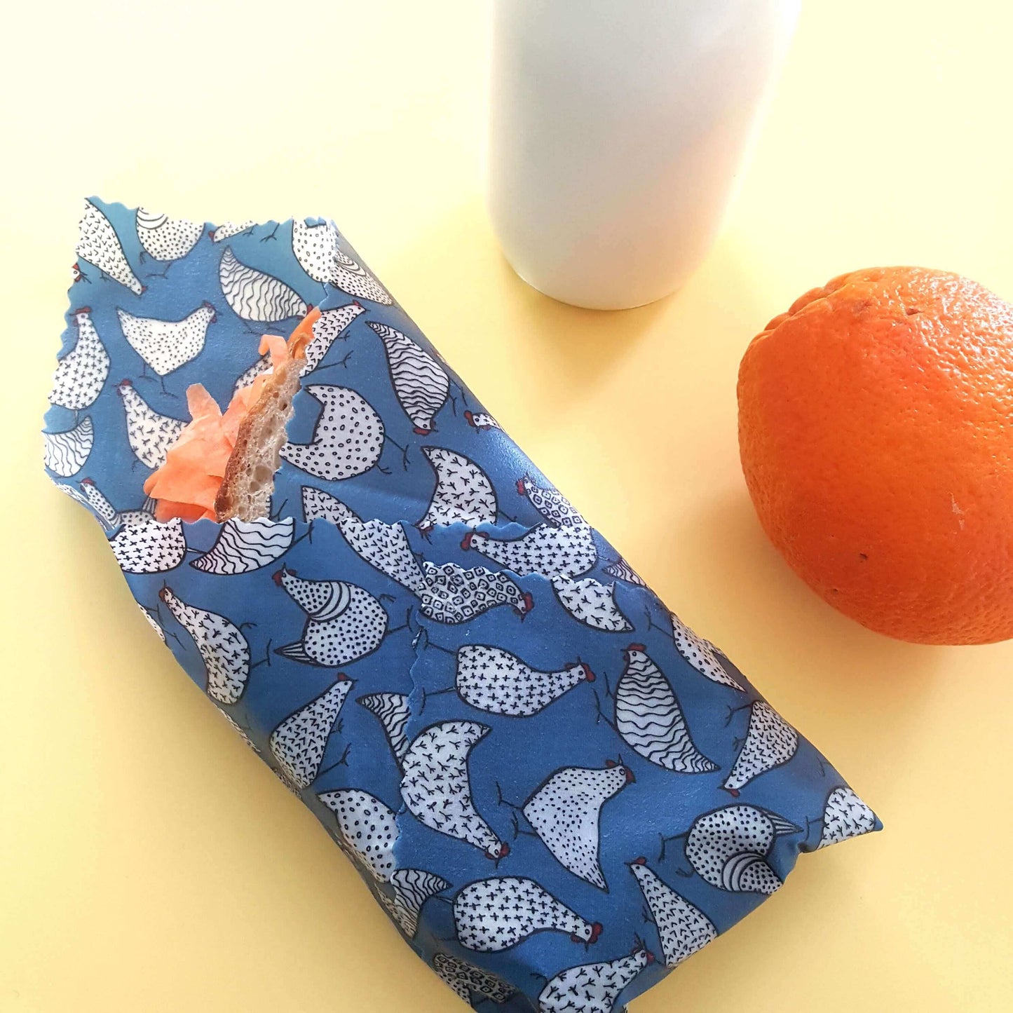 Reusable Beeswax Food Wraps 100% Hand Made in the UK by Honey Bee Good. Planet-Kind single large beeswax wrap in Blue Hens pattern as flatlay