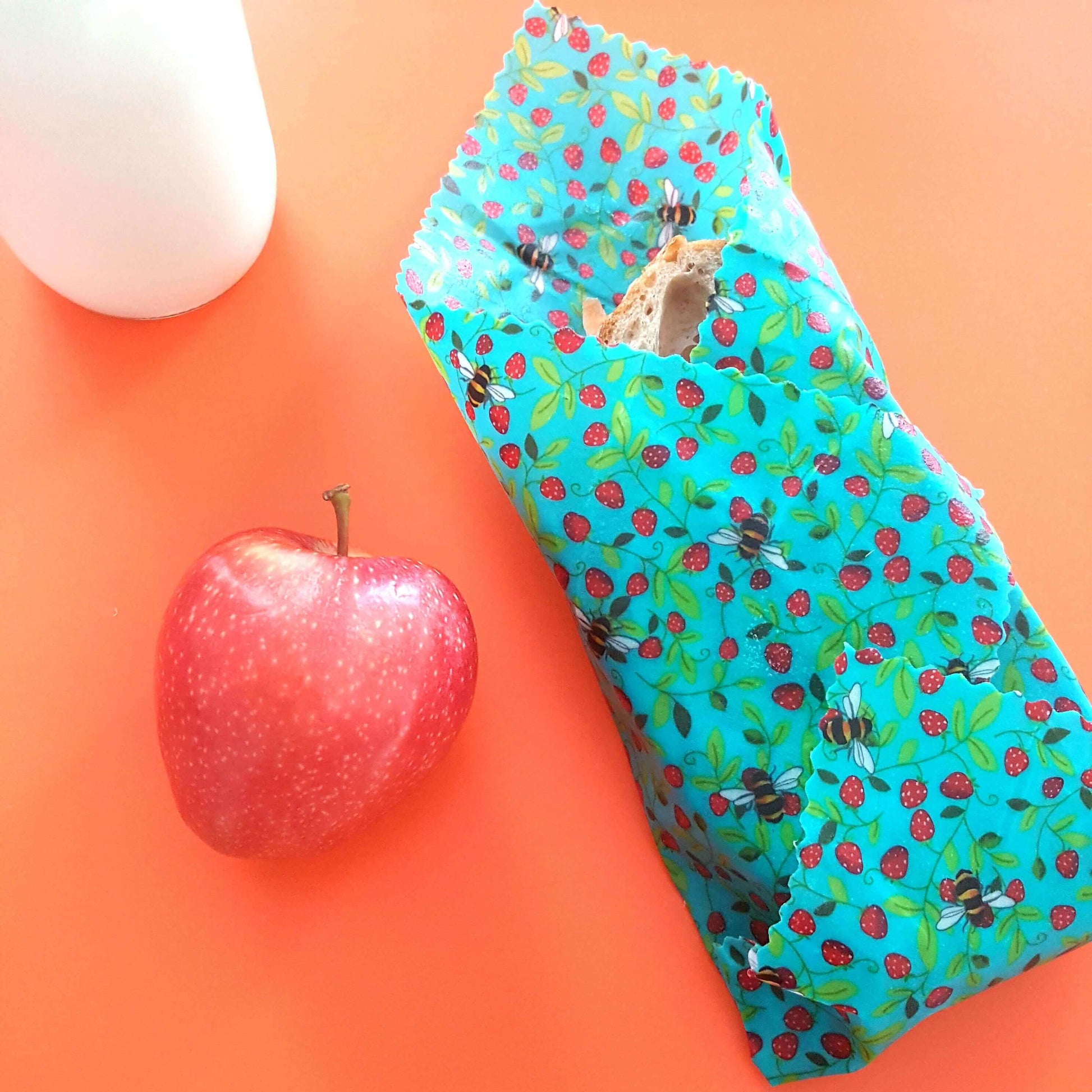 Planet-Kind single large beeswax wrap in Strawberry Bees pattern as flatlay