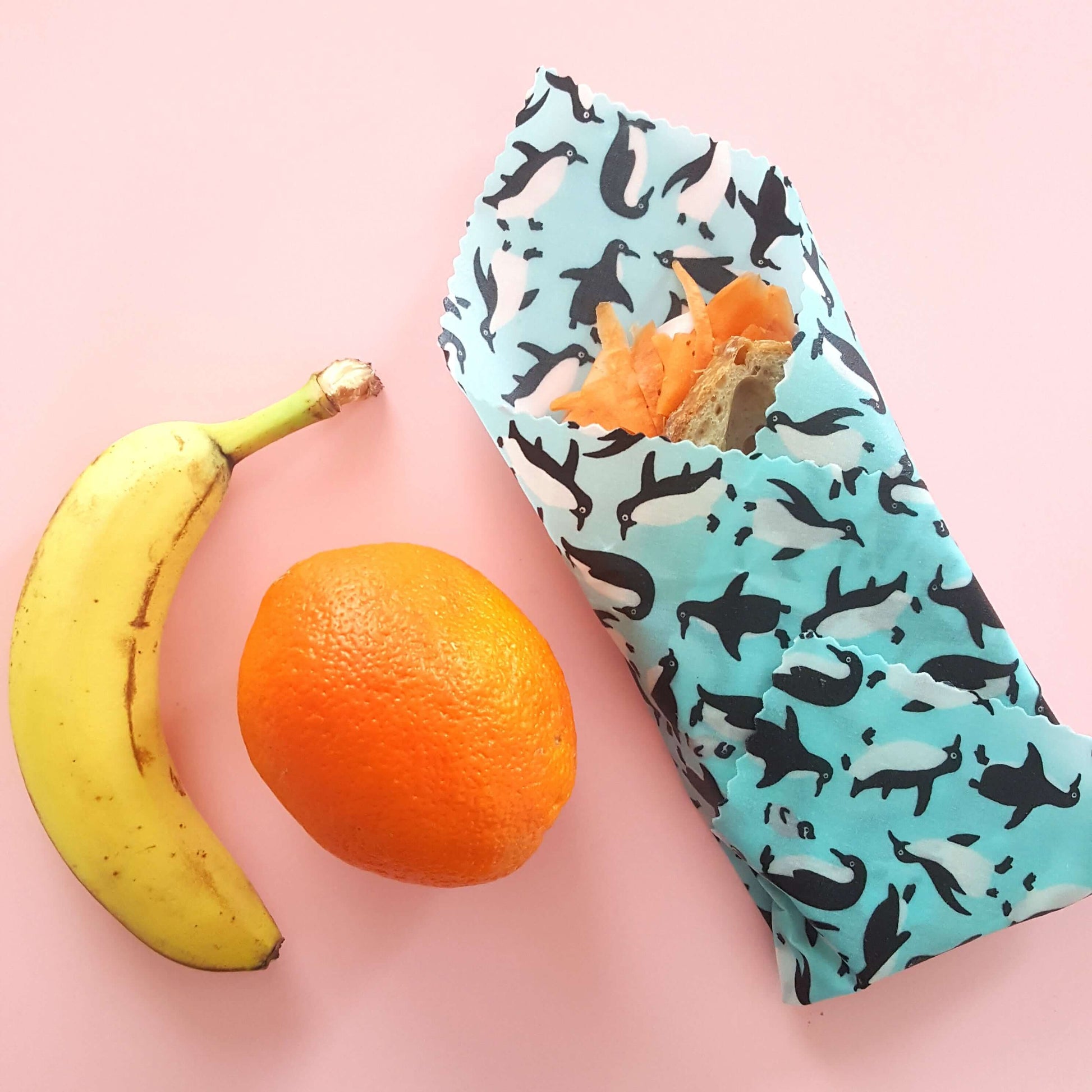 Planet-Kind single large beeswax wrap in Penguins pattern as flatlay