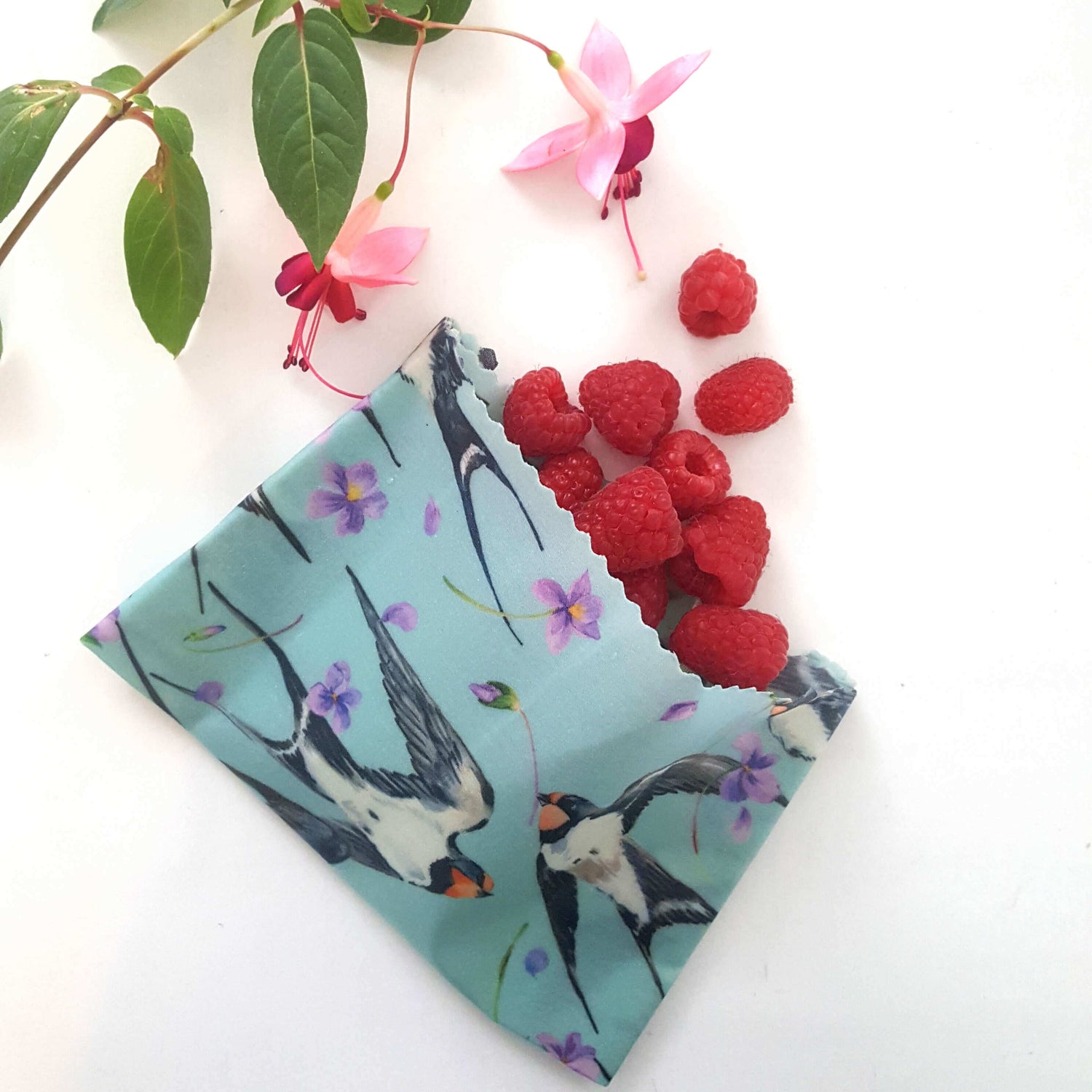 Reusable Beeswax Food Wraps 100% Hand Made in the UK with Love shown in the Autumn Swifts collection for Christmas. Folded as a snack bag.