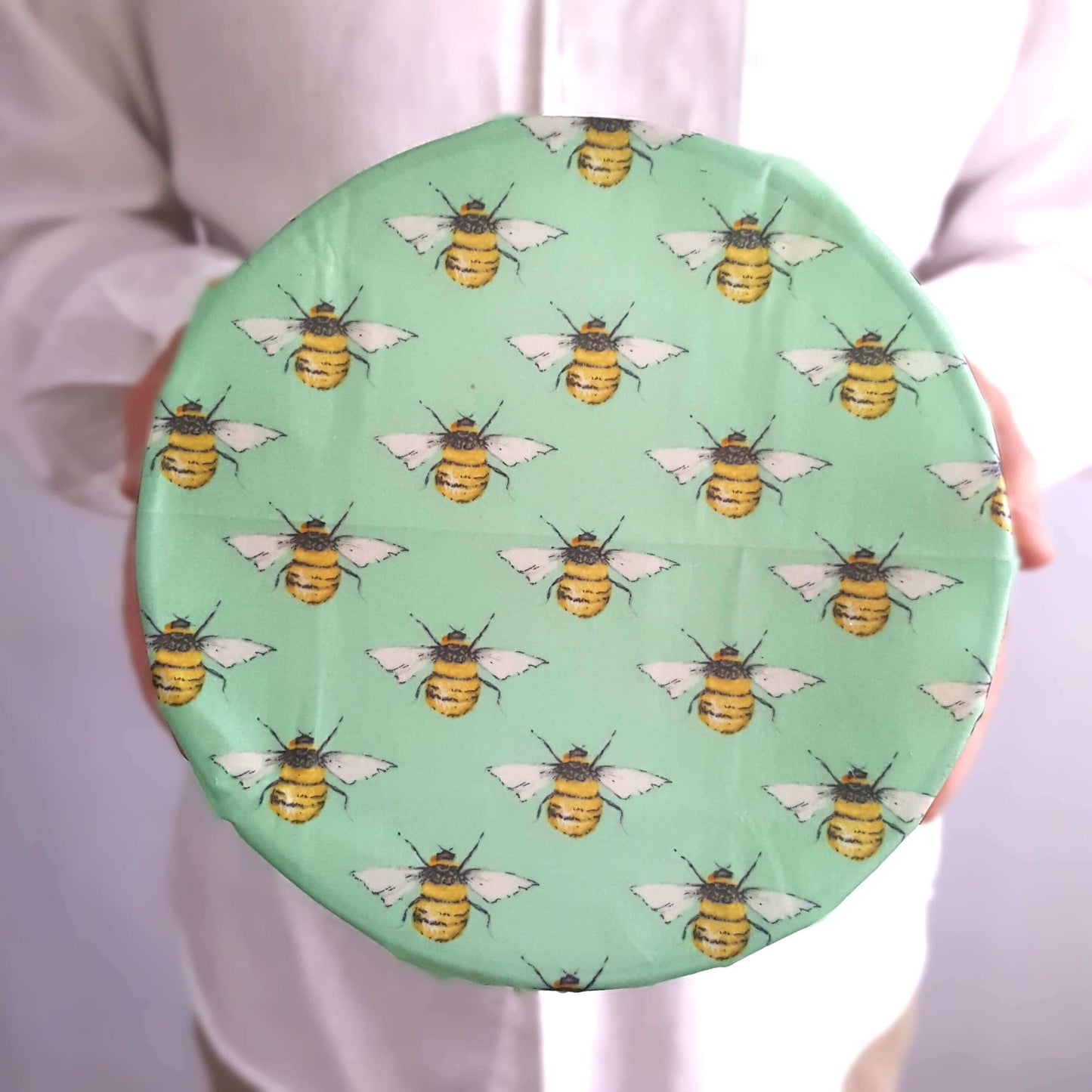 Reusable Beeswax Food Wraps 100% Hand Made in the UK by Honey Bee Good shown in Set of 3 Classic Penguins, Hens & Bees on bowl