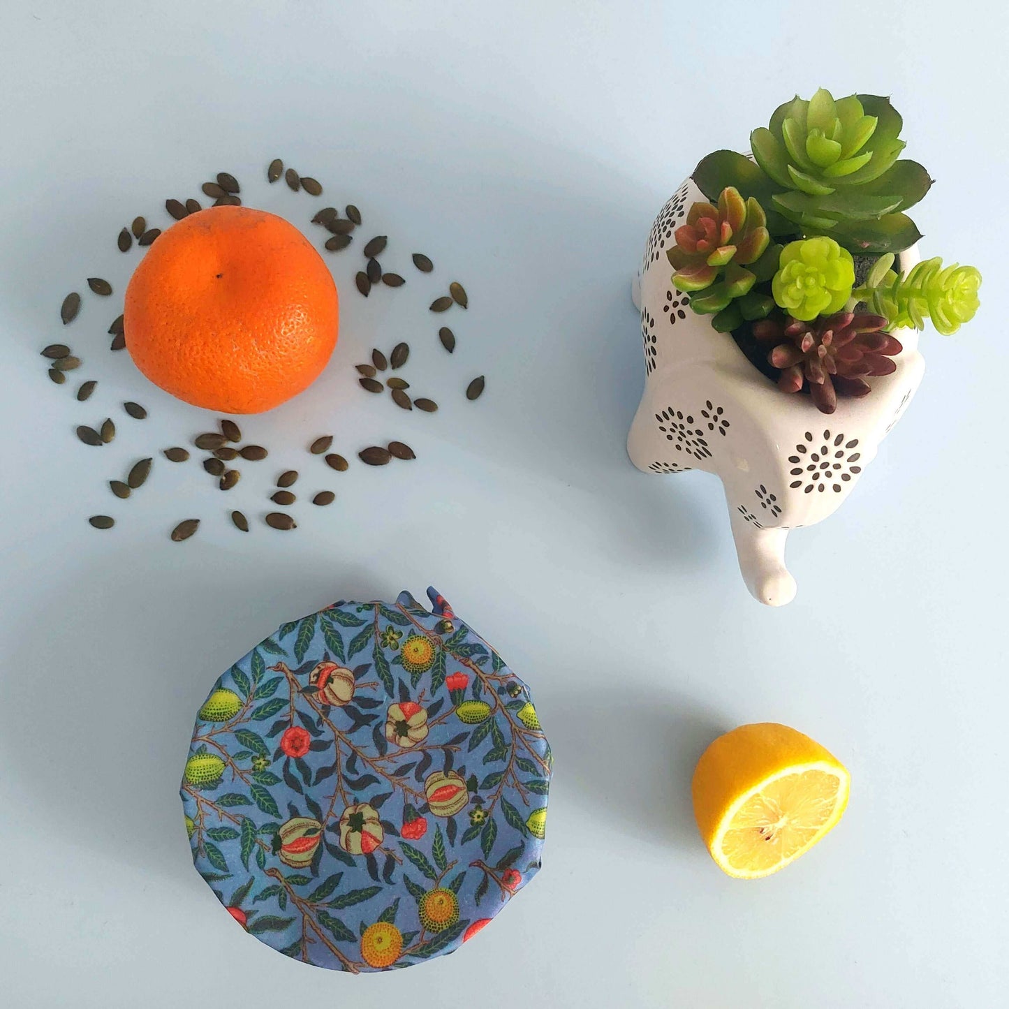 Reusable Beeswax Food Wraps 100% Hand Made in the UK by Honey Bee Good shown in William Morris Pomegranate flatlay