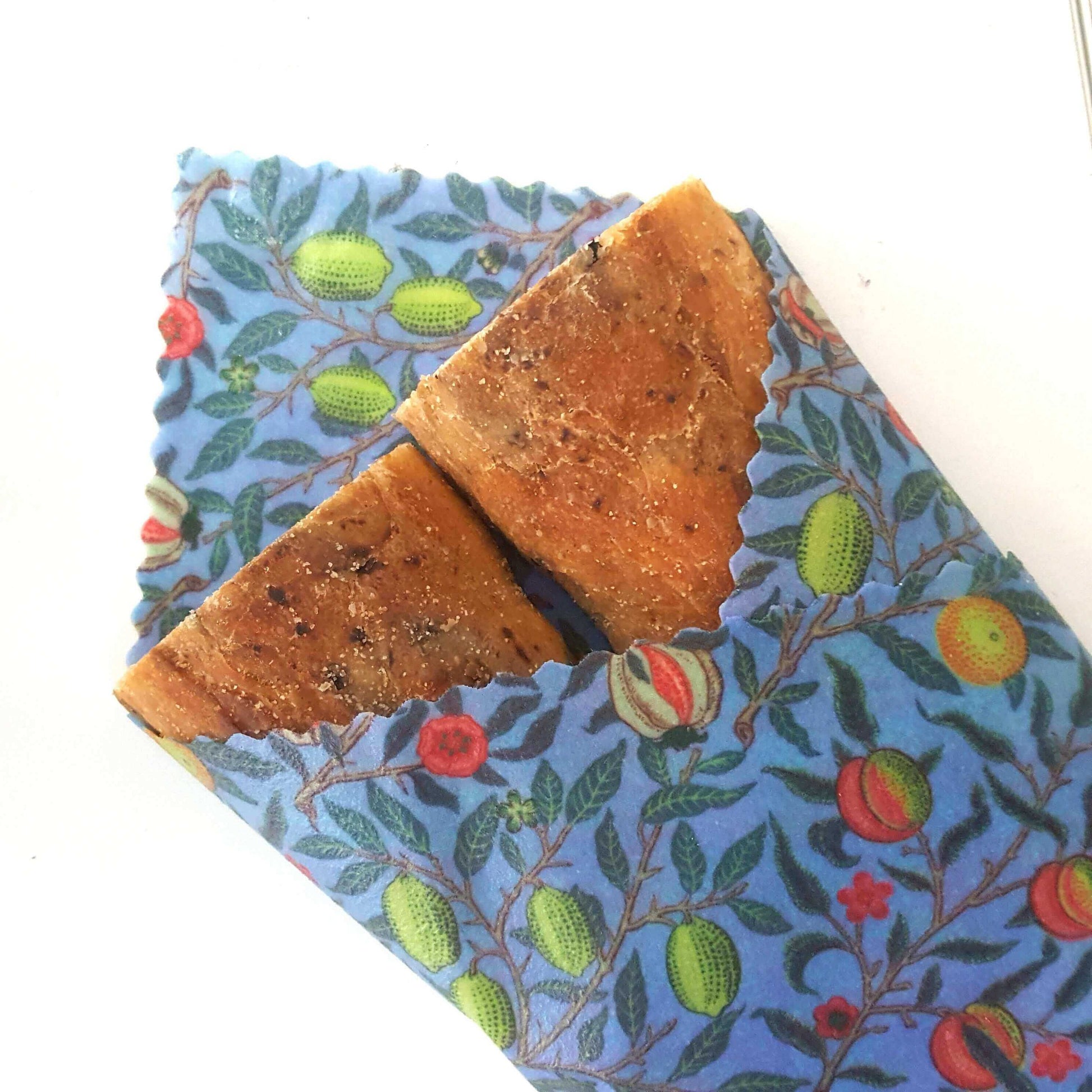Reusable Beeswax Food Wraps 100% Hand Made in the UK by Honey Bee Good shown in William Morris Pomegranate sandwich