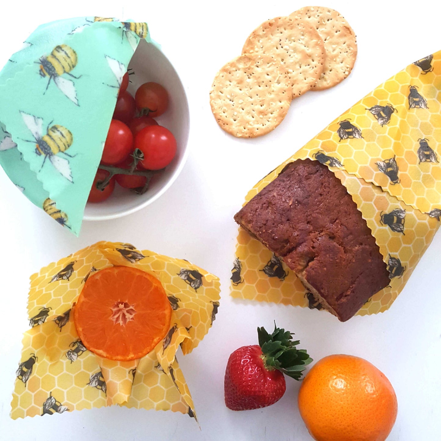 Reusable Beeswax Food Wraps 100% Hand Made in the UK by Honey Bee Good shown in Set of 3 Classic Bee Happy pattern flatlay