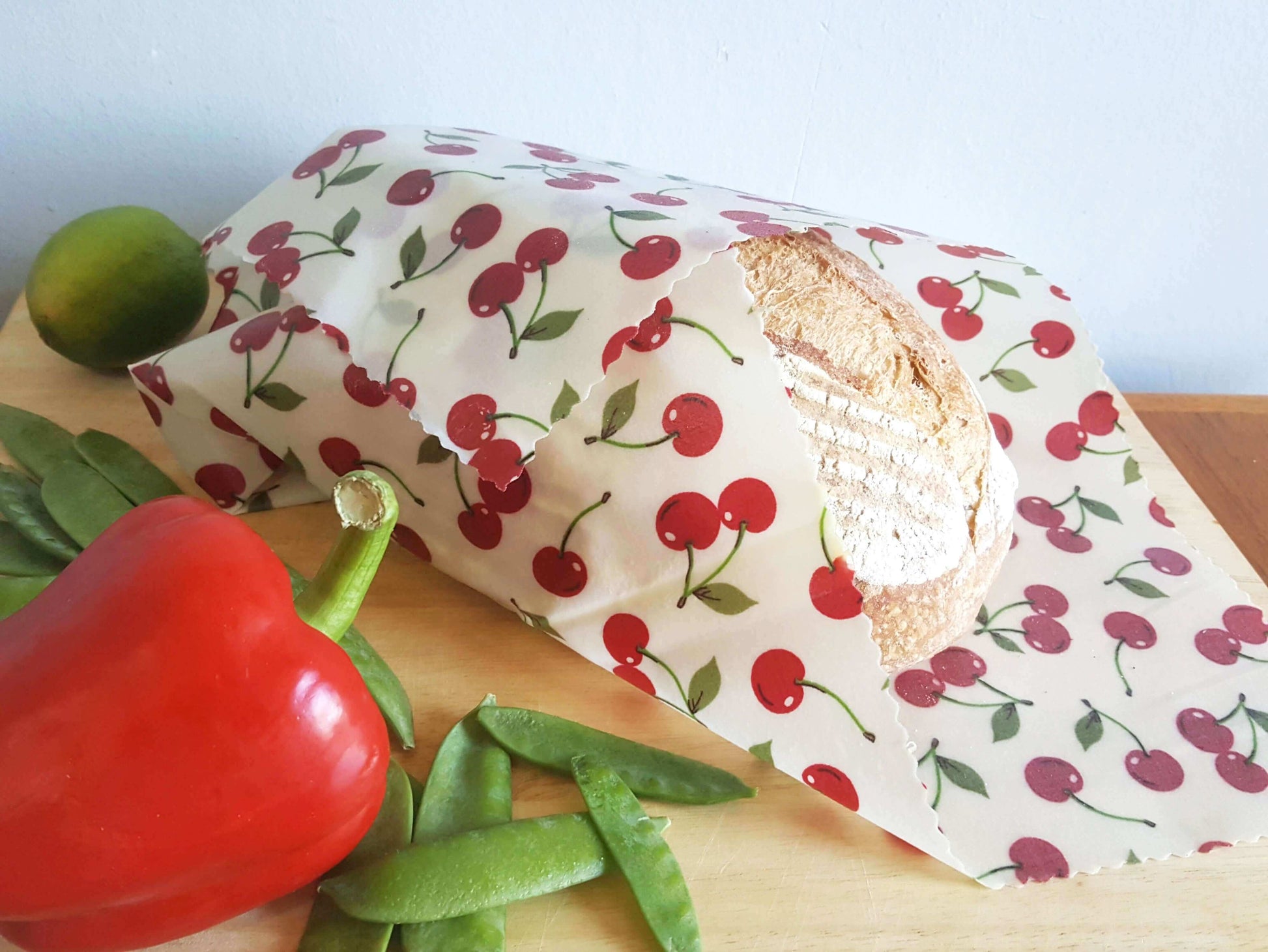 Reusable Beeswax Food Wraps 100% Hand Made in the UK by Honey Bee Good shown in Classic XXL Bread Wrap cherries lifestyle